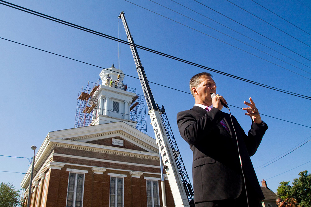 Jerry Finn stands outside Town Clock Church in New Albany