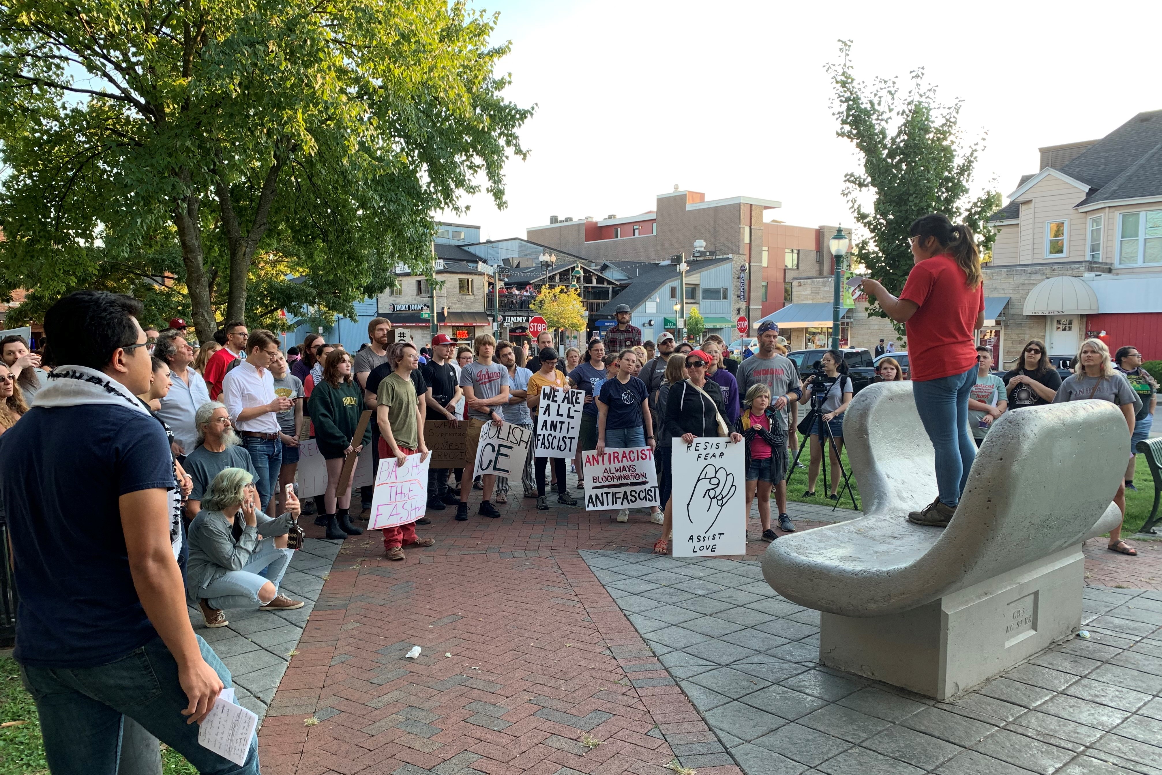 YDSA's Jess Tang (they/them) speaks at a rally before the march. 