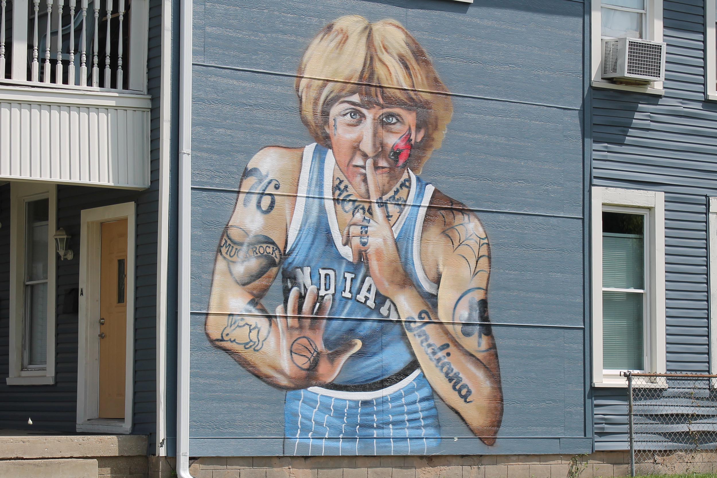 Muck Rock's mural is on the side of a private, multi-family home in Indianapolis's Fountain Square neighborhood.