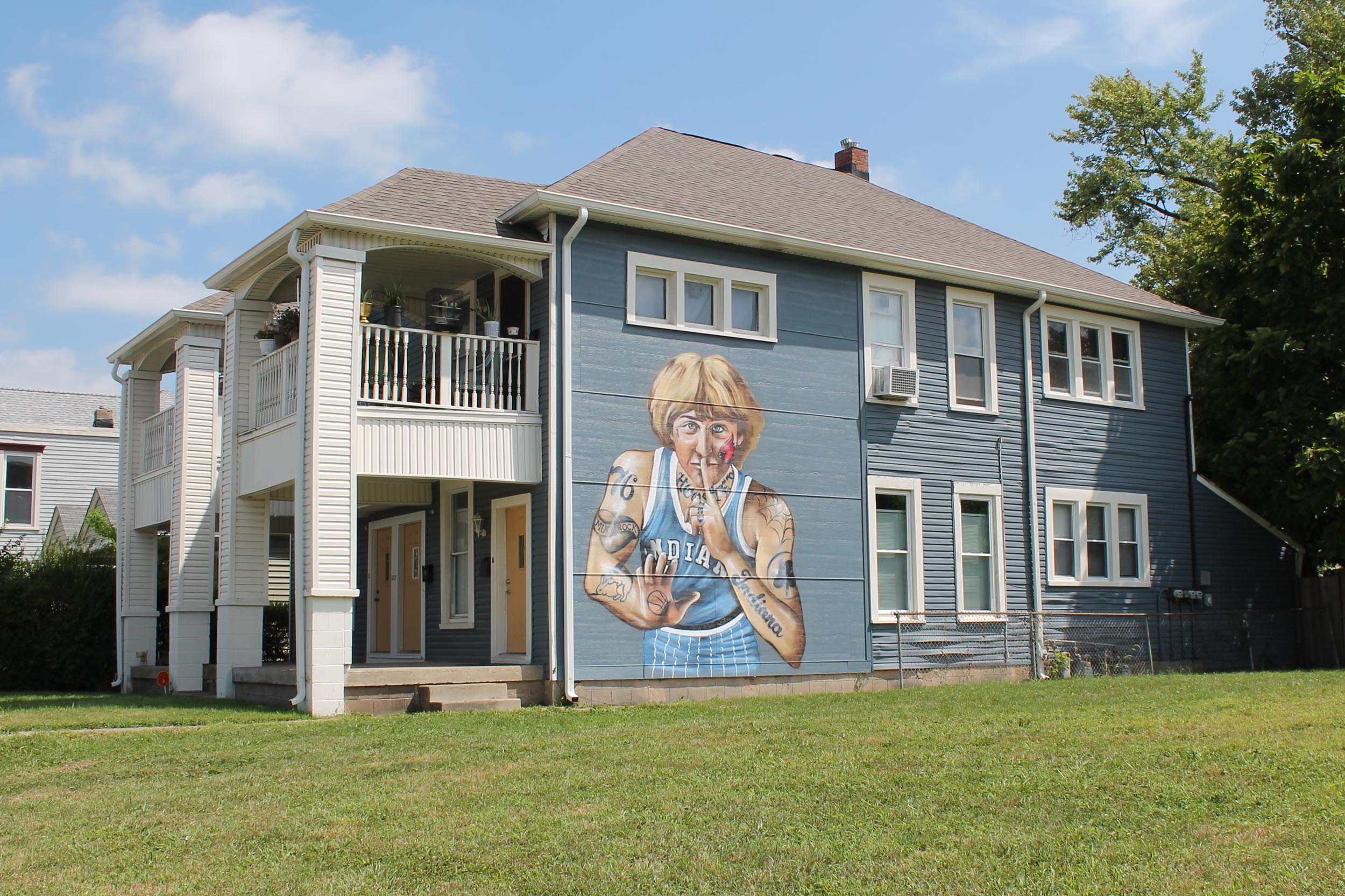 Muck Rock's mural is on the side of a private, multi-family home in Indianapolis's Fountain Square neighborhood. 