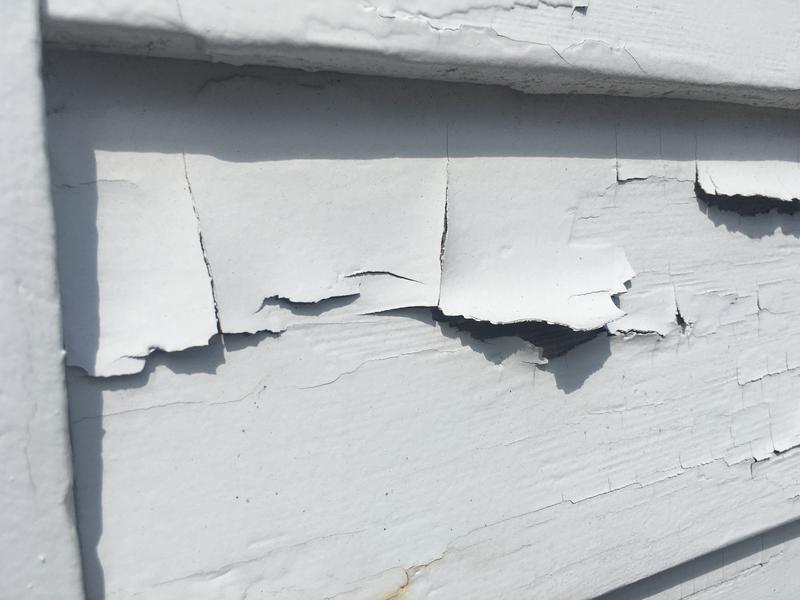 Lead paint peeling off the side of a home. 