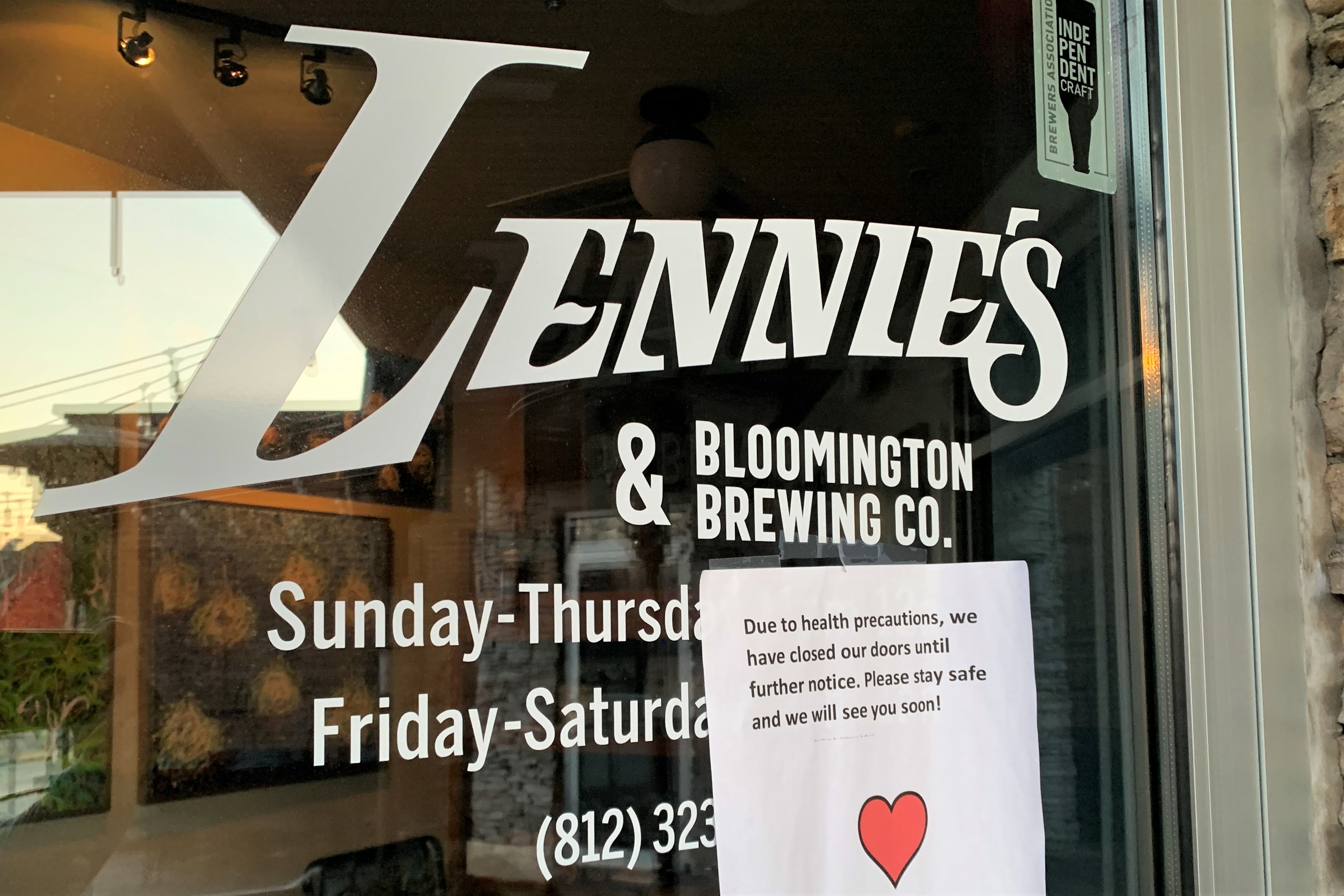 A sign on the door of Lennie's restaurant in Bloomington tells customers it's closed indefinitely because of COVID-19 concerns.