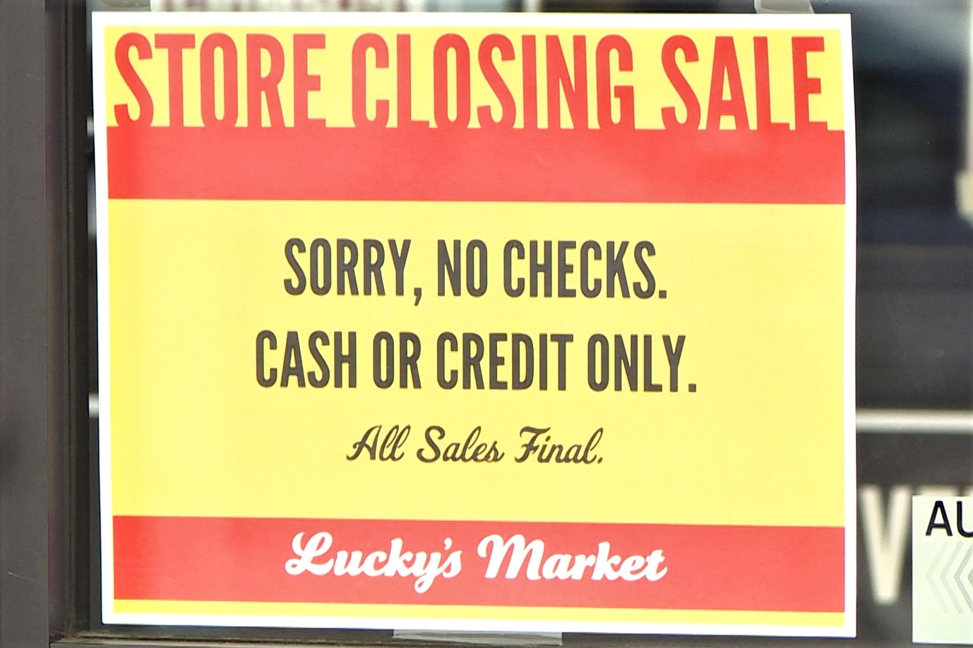 A store closing sign at Lucky's Market in Bloomington.