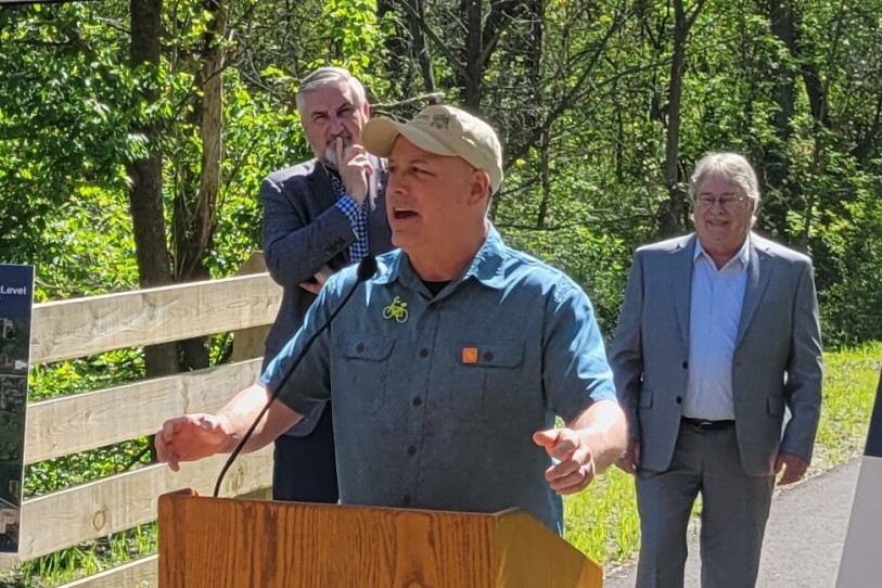Mitch Barloga, president of the Greenways Foundation of Indiana and an active transportation planner with the Northwestern Indiana Regional Planning Commission, speaks during the ribbon cutting of the C&amp;O Greenway extension on April 30, 2024.