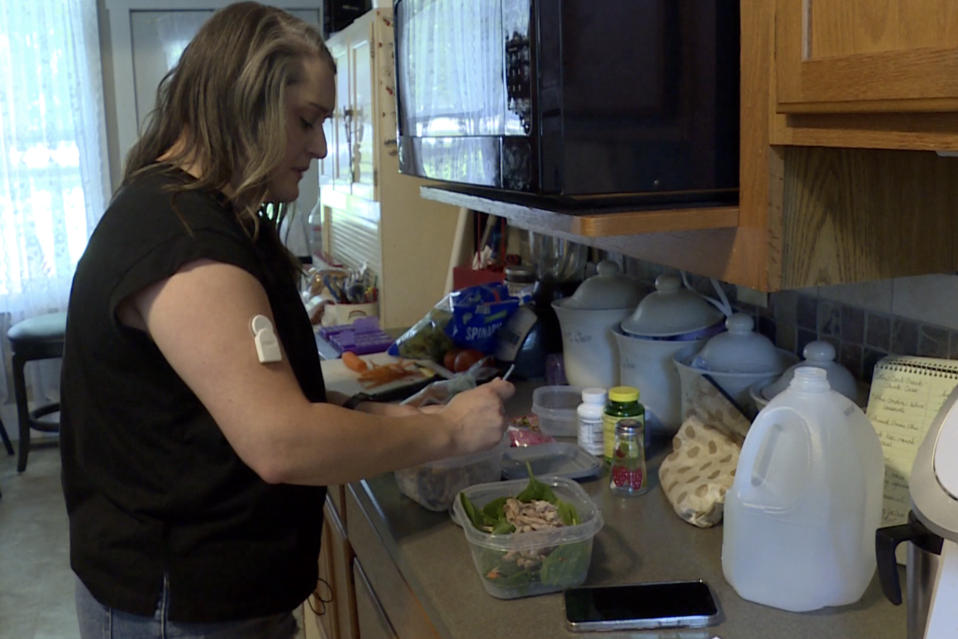 Molly King prepares food before taking her insulin