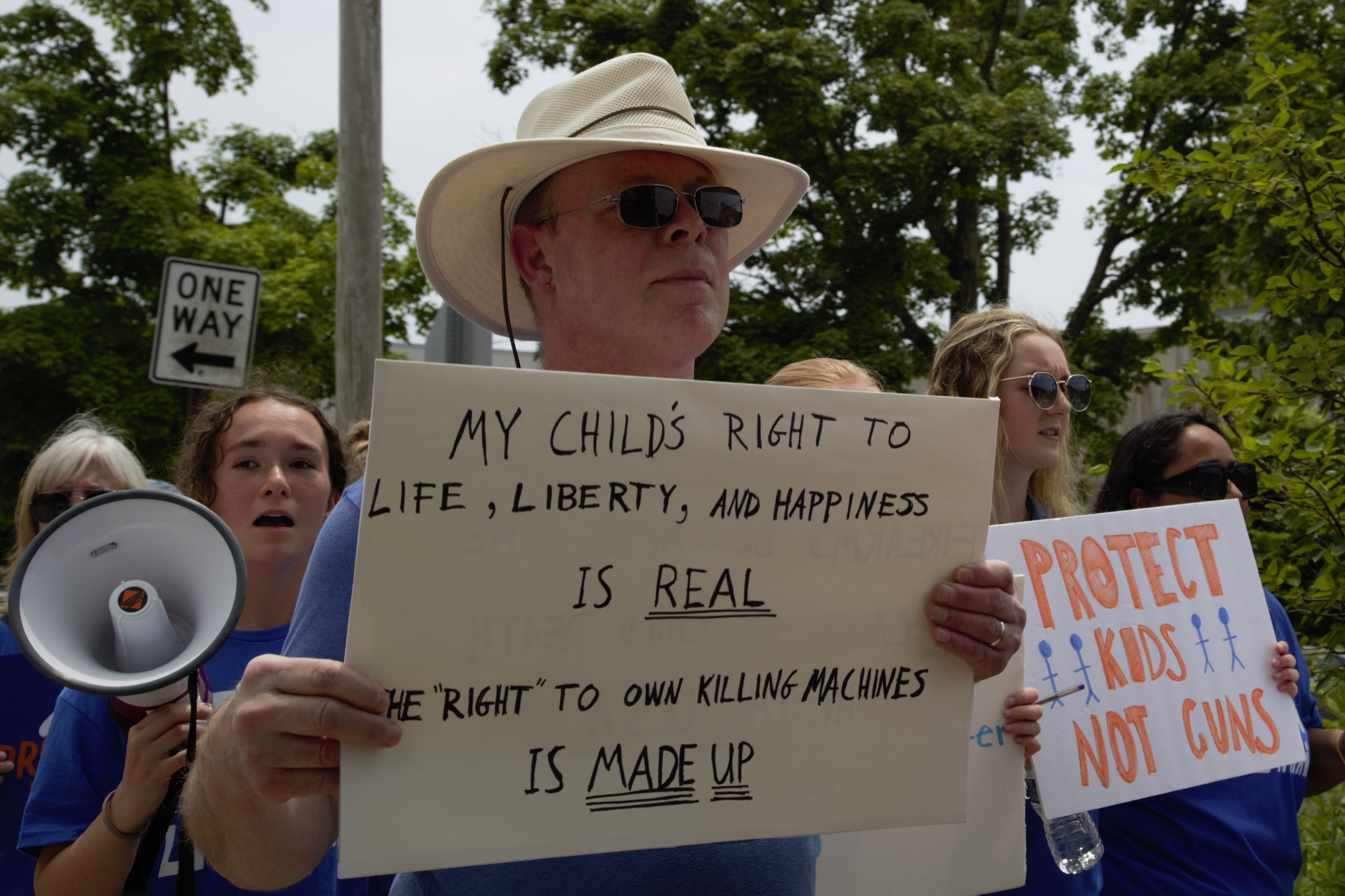 Nels Boerner with sign at March for Our Lives, June 11, 2022