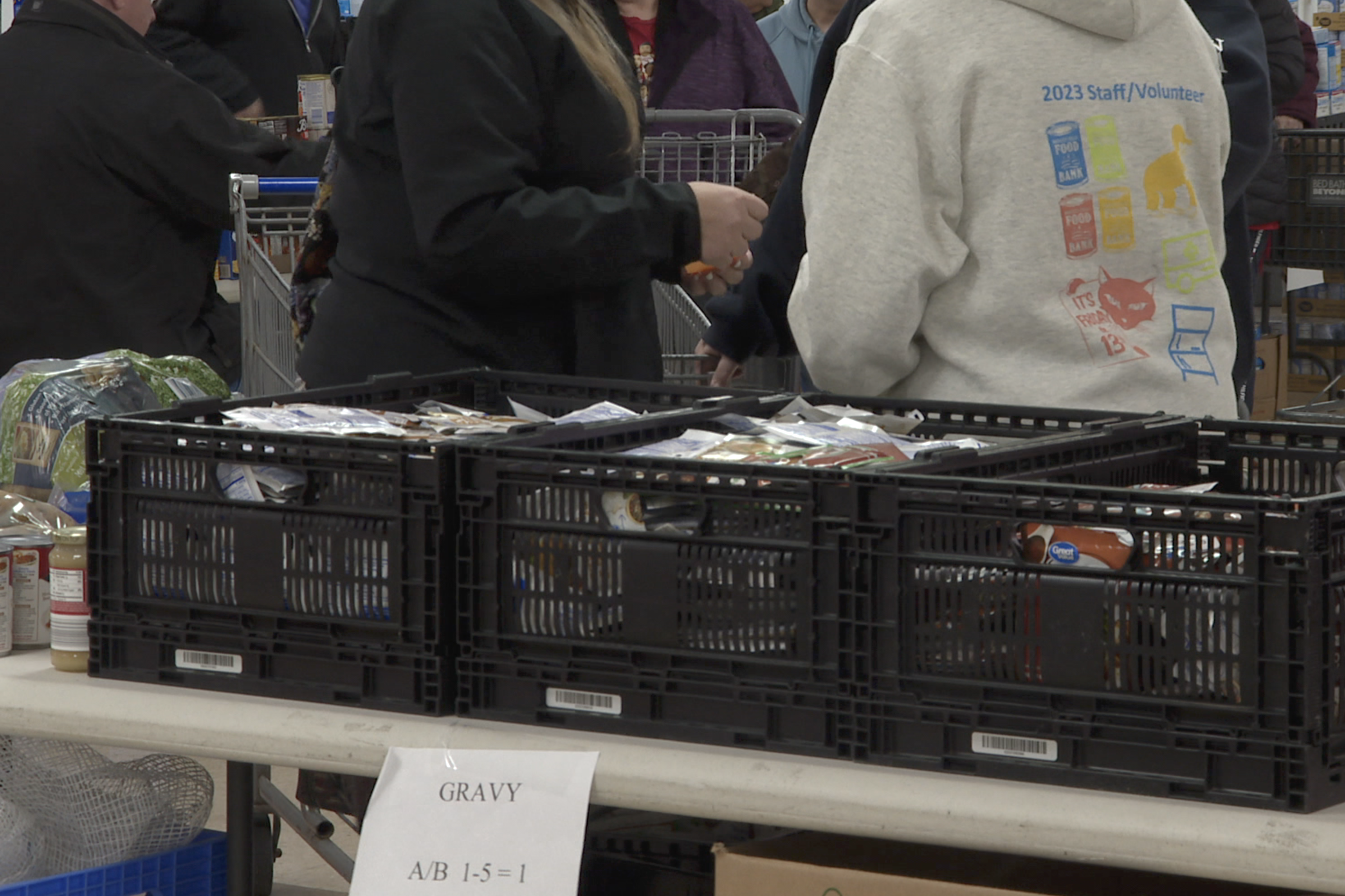 Volunteers distribute meal kits for Pantry 279's Thanksgiving food distribution.