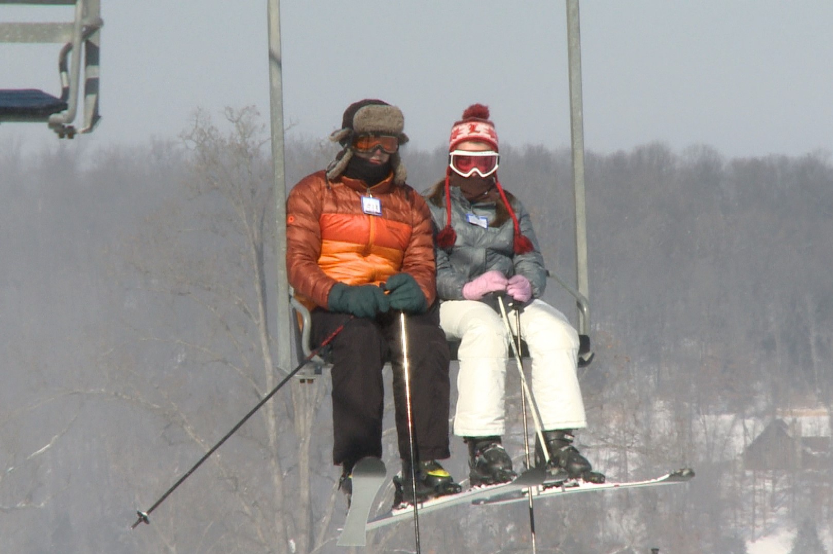 Two people on a ski lift at Paoli Peaks.