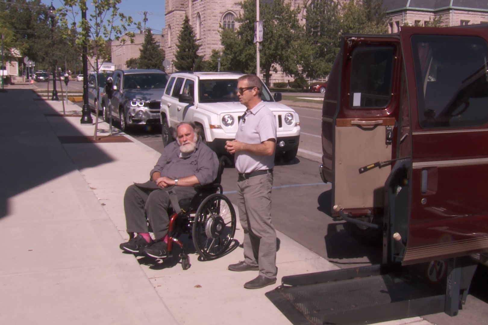 Man showing a parking spot that is accessible