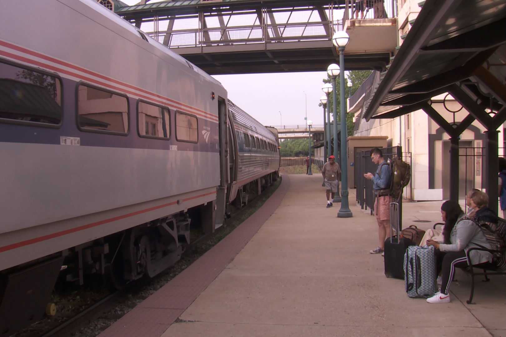 People wait for train