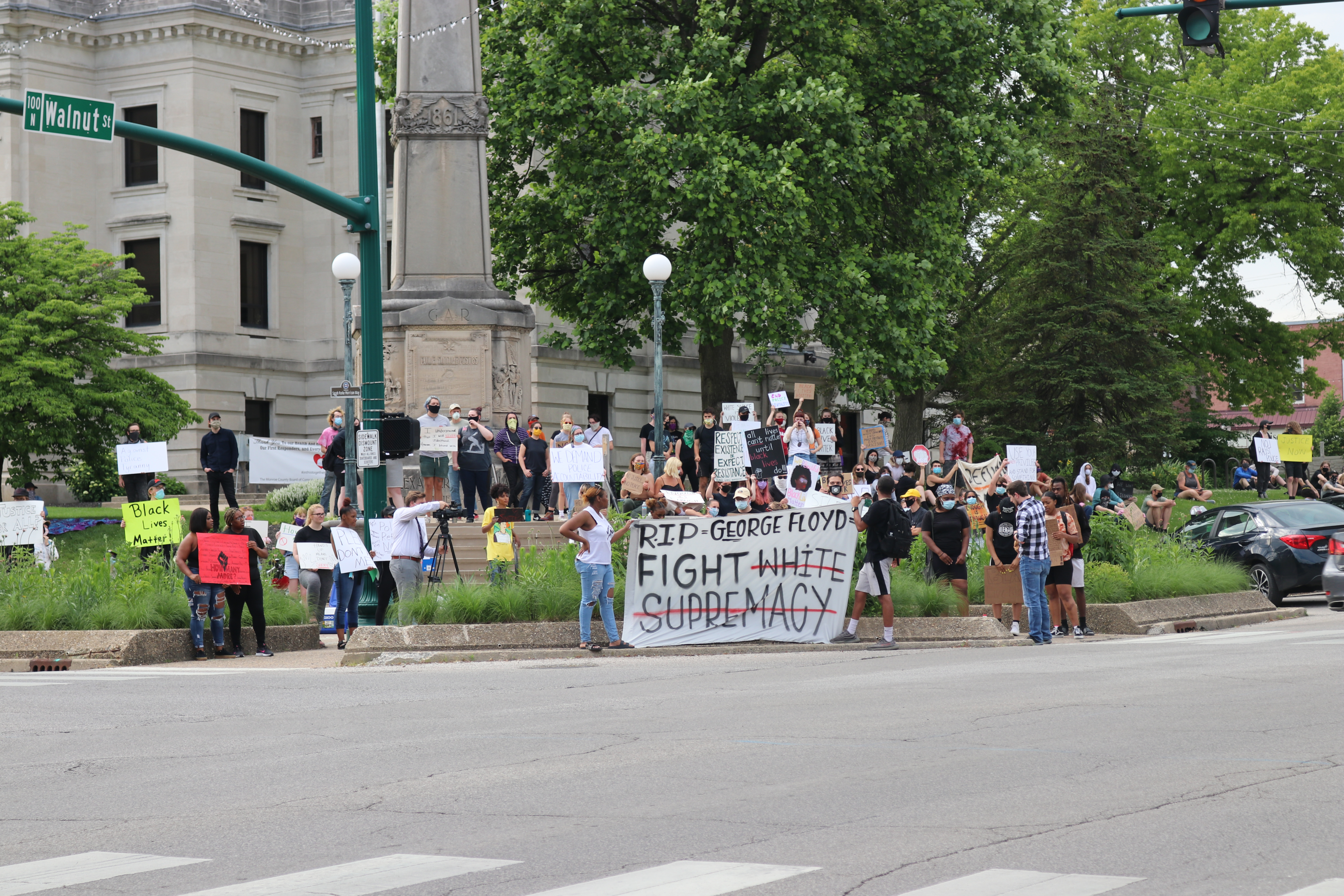 Protesters gather outside of the Monroe County Courthouse.