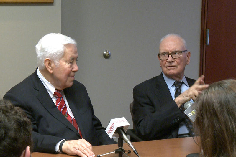 Richard Lugar and Lee Hamilton sit at a table.