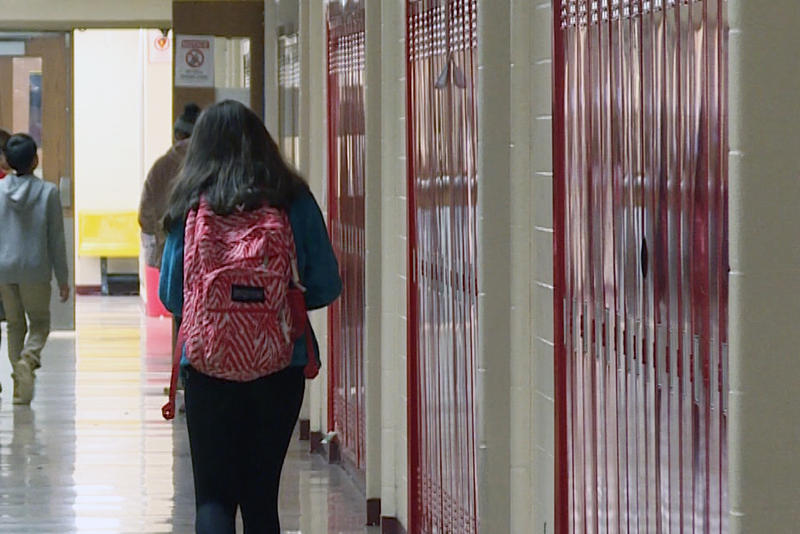 A girl walks down a hallway at River Forest Middle School.
