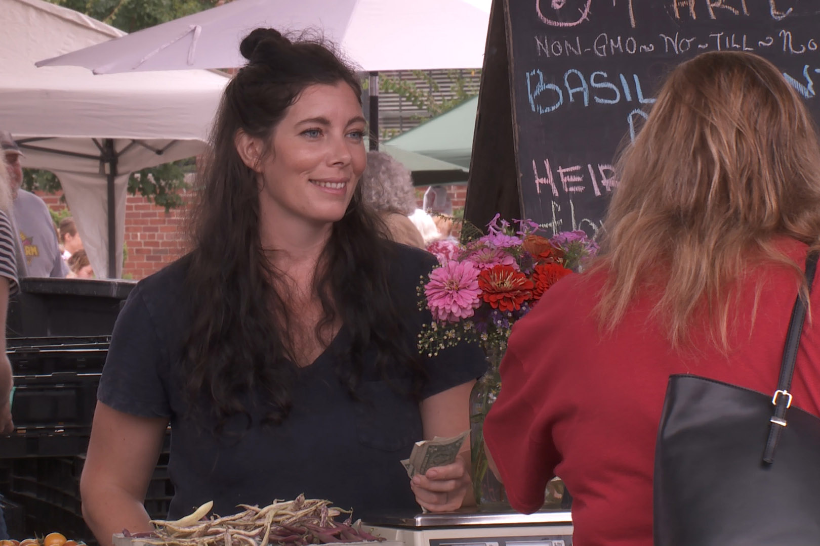 Schooner Creek Farm owner Sarah Dye at the farmers' market, Sept. 21, 2019.