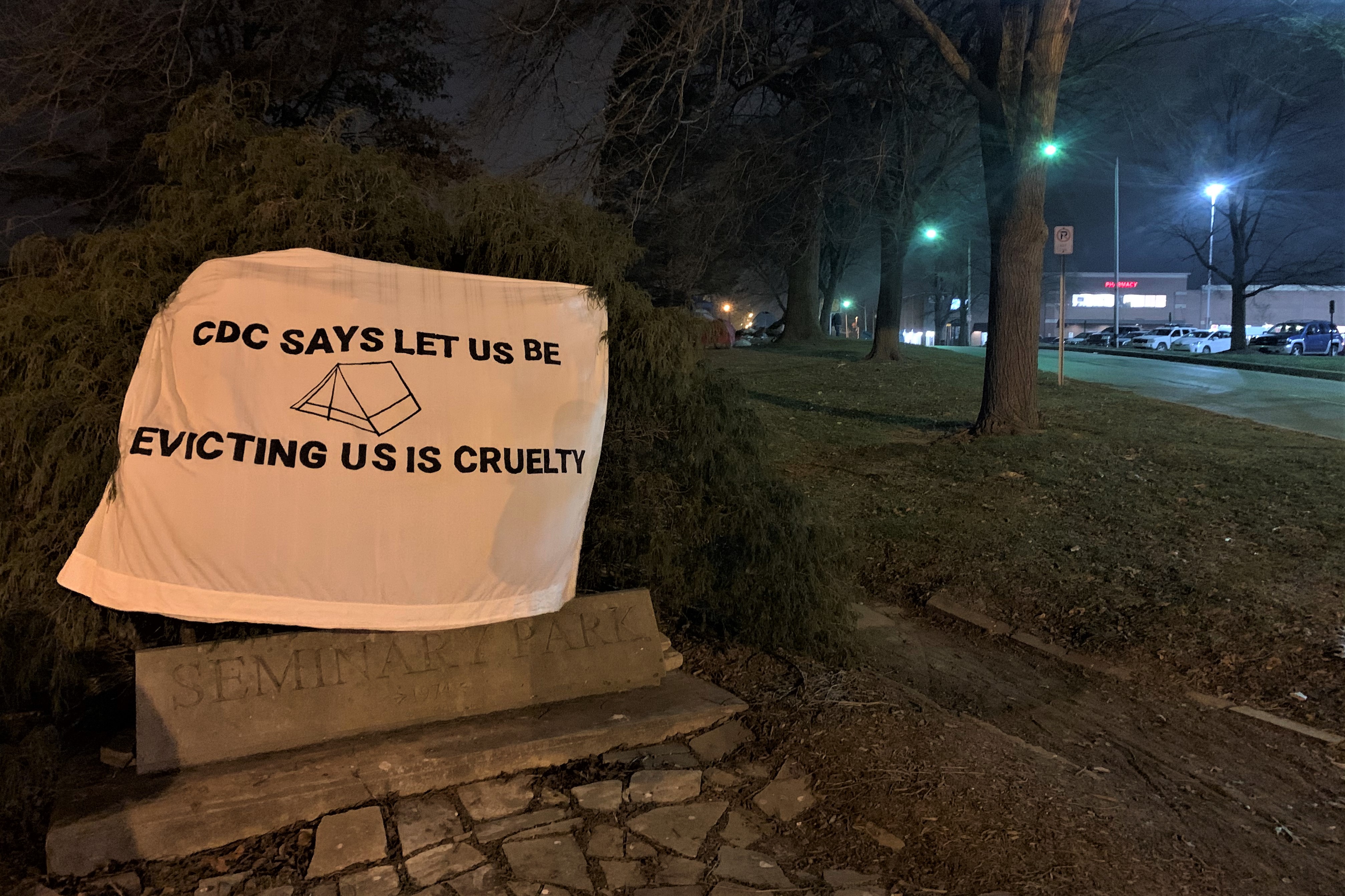 A sign protesting the scheduled eviction of unhoused individuals camping in Seminary Park, Jan. 11, 2021.