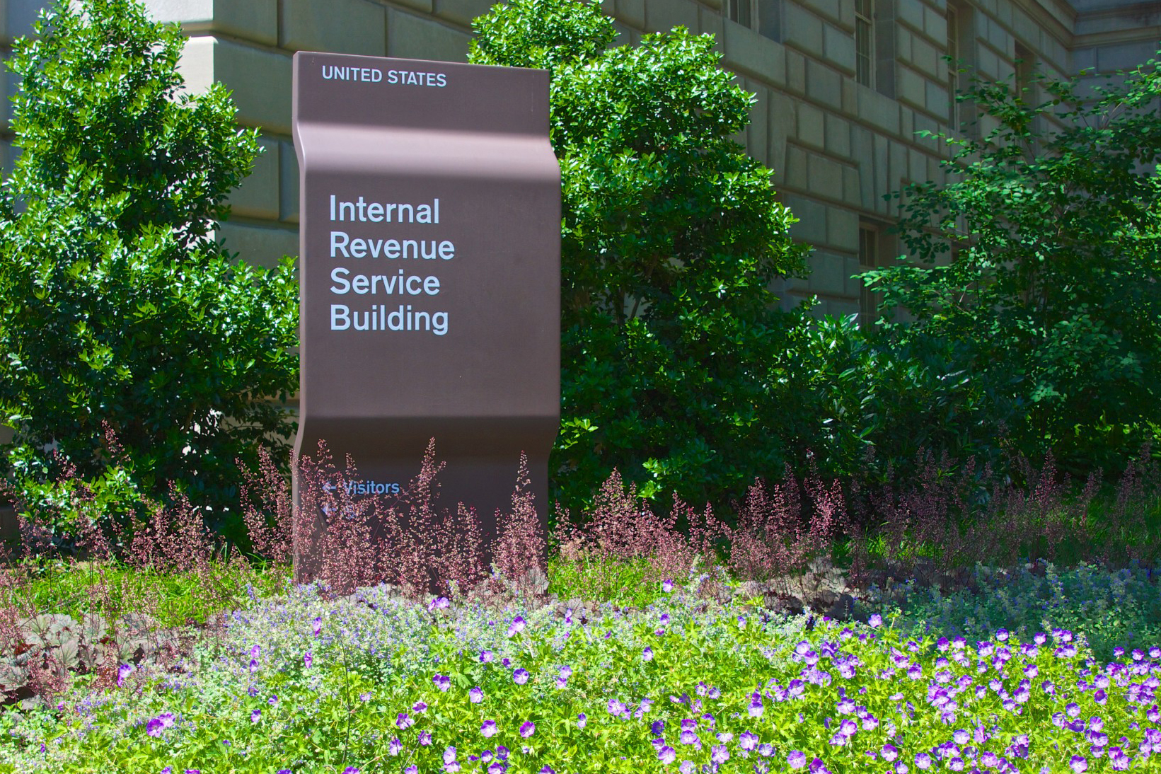 A sign outside an IRS (internal revenue service) building.