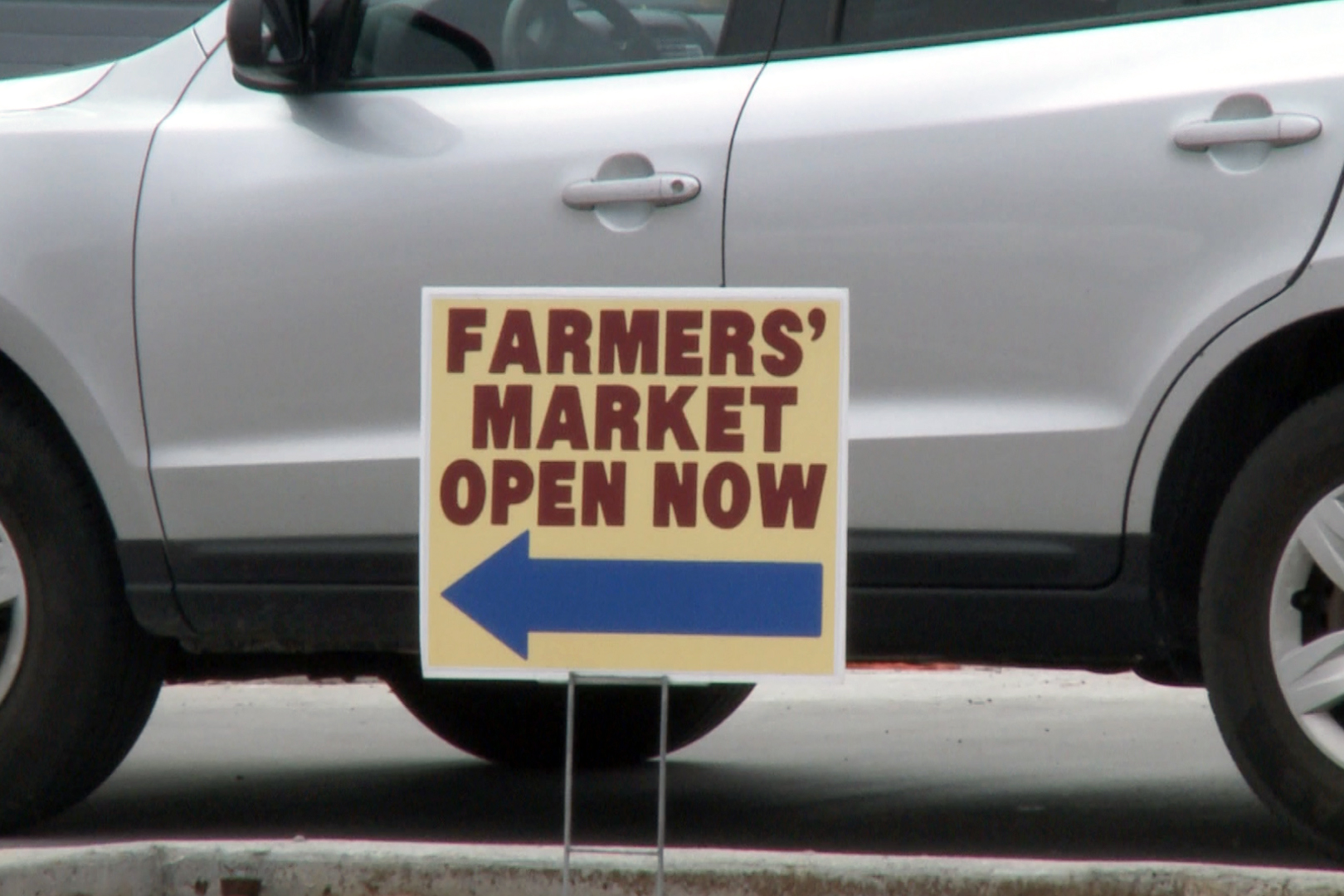 sign in front of car