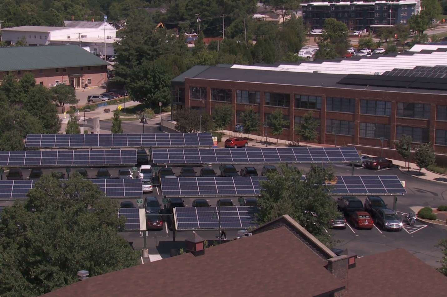 Solar panels on top of the car shelters in the City Hall parking lot in Bloomington as seen from above.