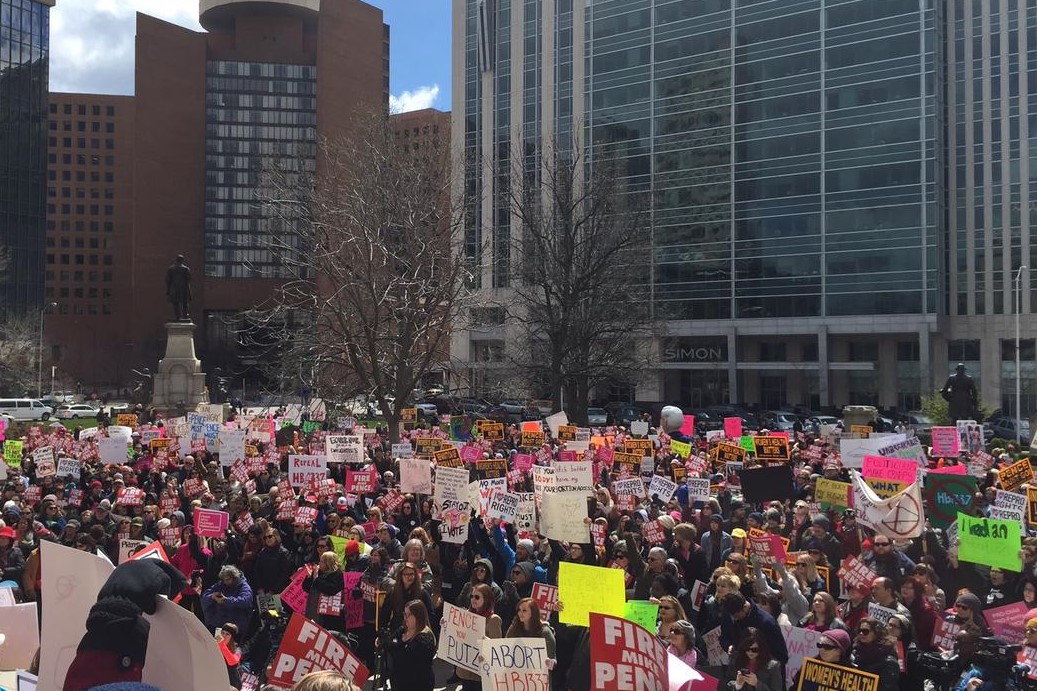 People rally outside the Statehouse in 2016 over an Indiana anti-abortion law. 