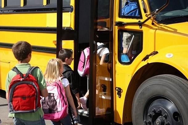 An image of children boarding a school bus.