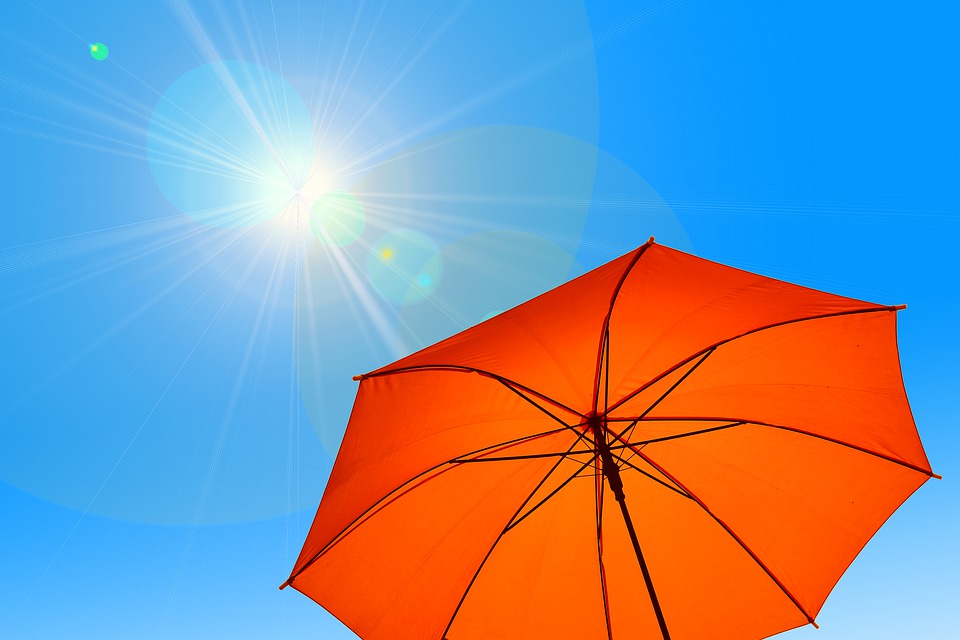 A stock image of a parasol and the sun.