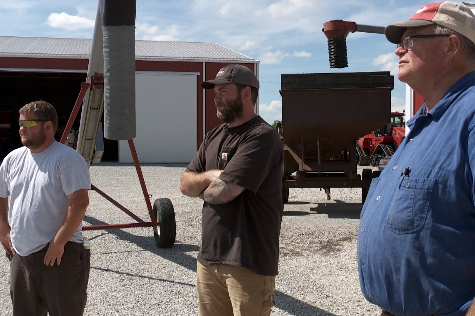 From the left, Matt, Carl, and Mark Seib look out on their family's farm.