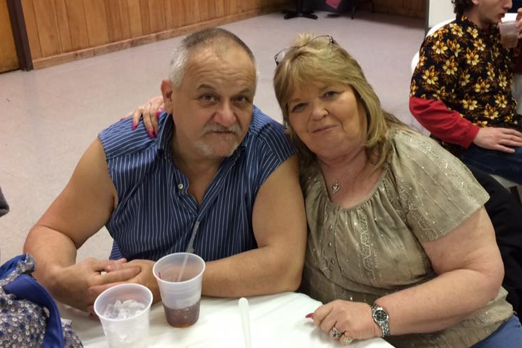 Tony Sizemore and Roberta "Birdie" Shelton sit together at a table.