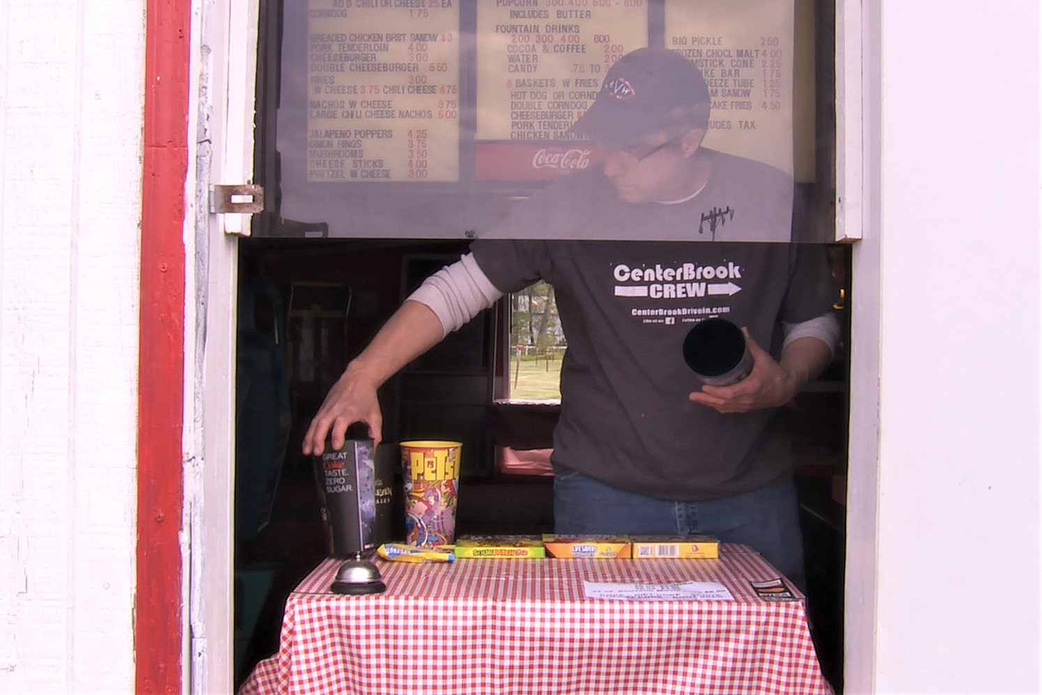 Centerbrook Drive-In Theater owner Tyler Tharpe shows off the adapted concession stand window.