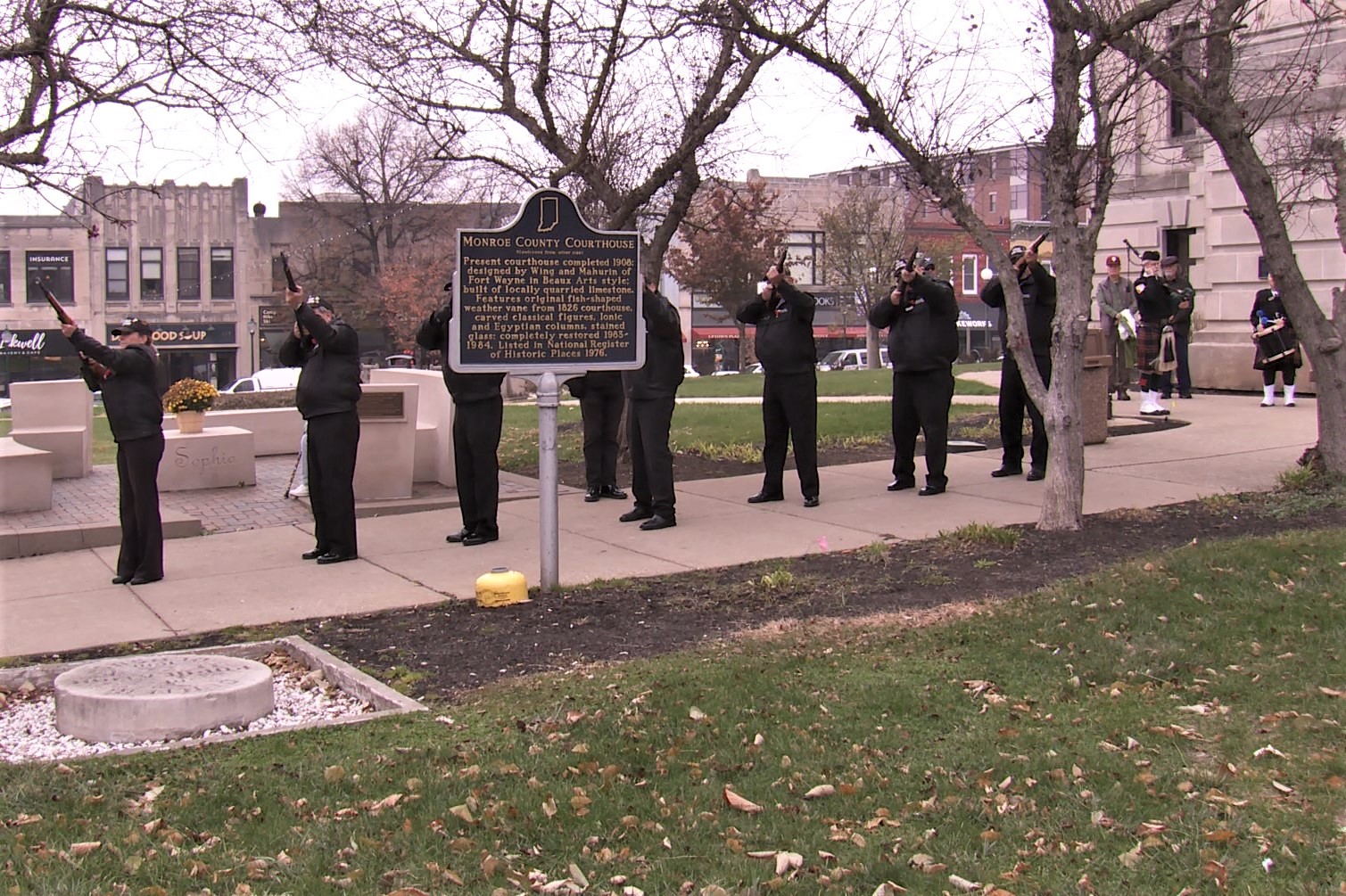 The Monroe County Veterans Honor Guard does a gun salute.