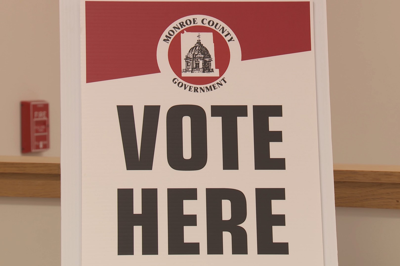 A sign reads "Vote Here" at a polling location in Bloomington, Nov. 5, 2019.
