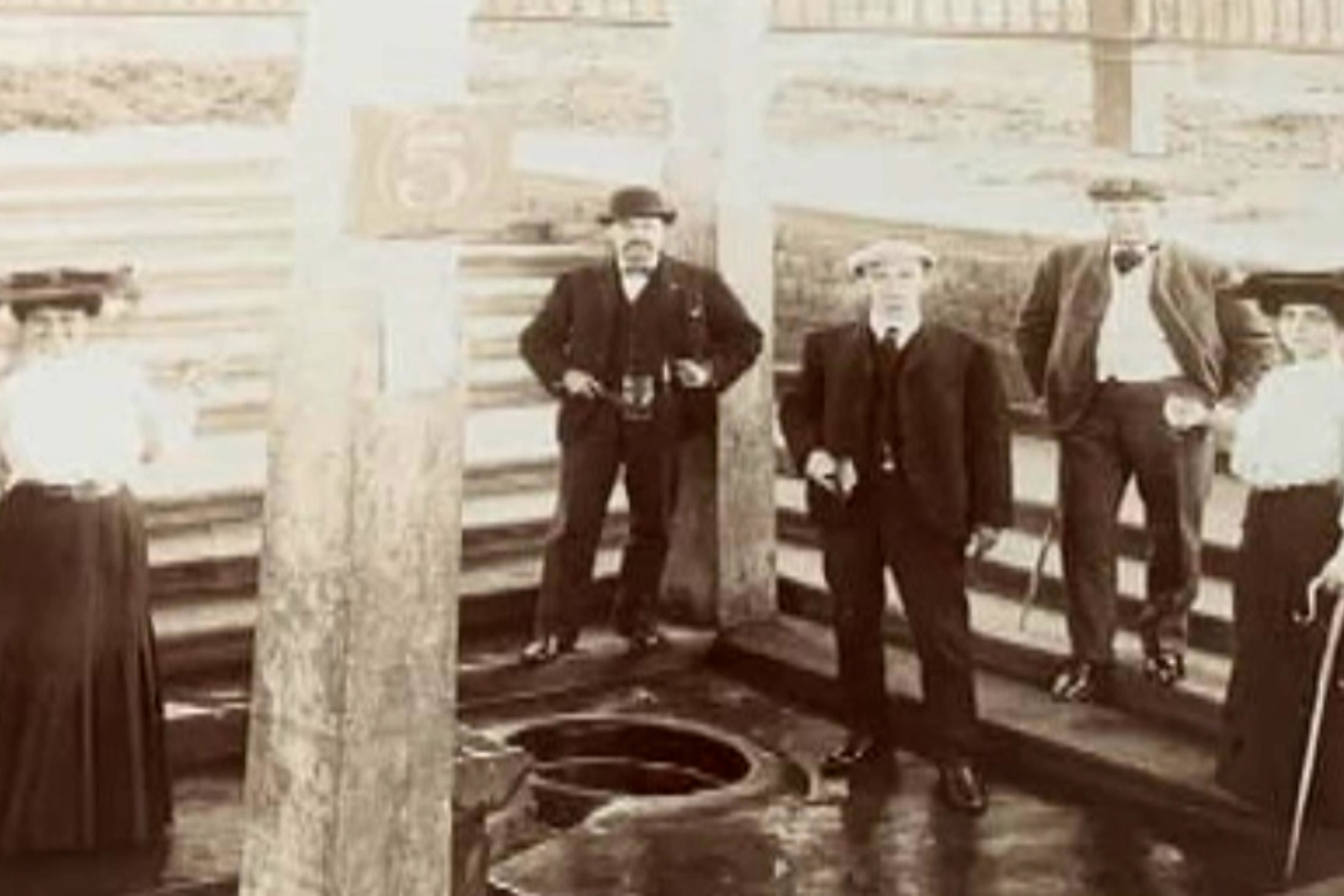 Visitors stand around the Neptune Spring, which was active from the 1890s to the 1910s 