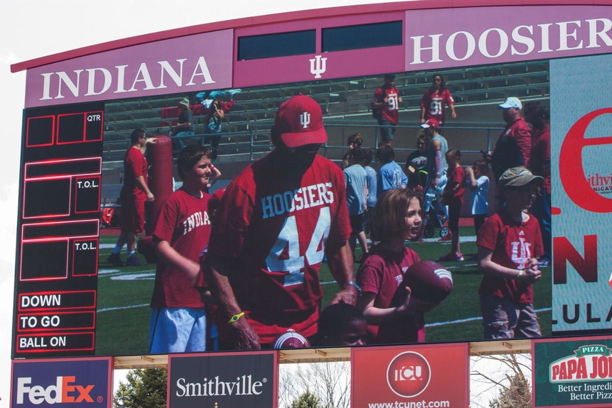 Spring football youth camp action on the Memorial Stadium video board