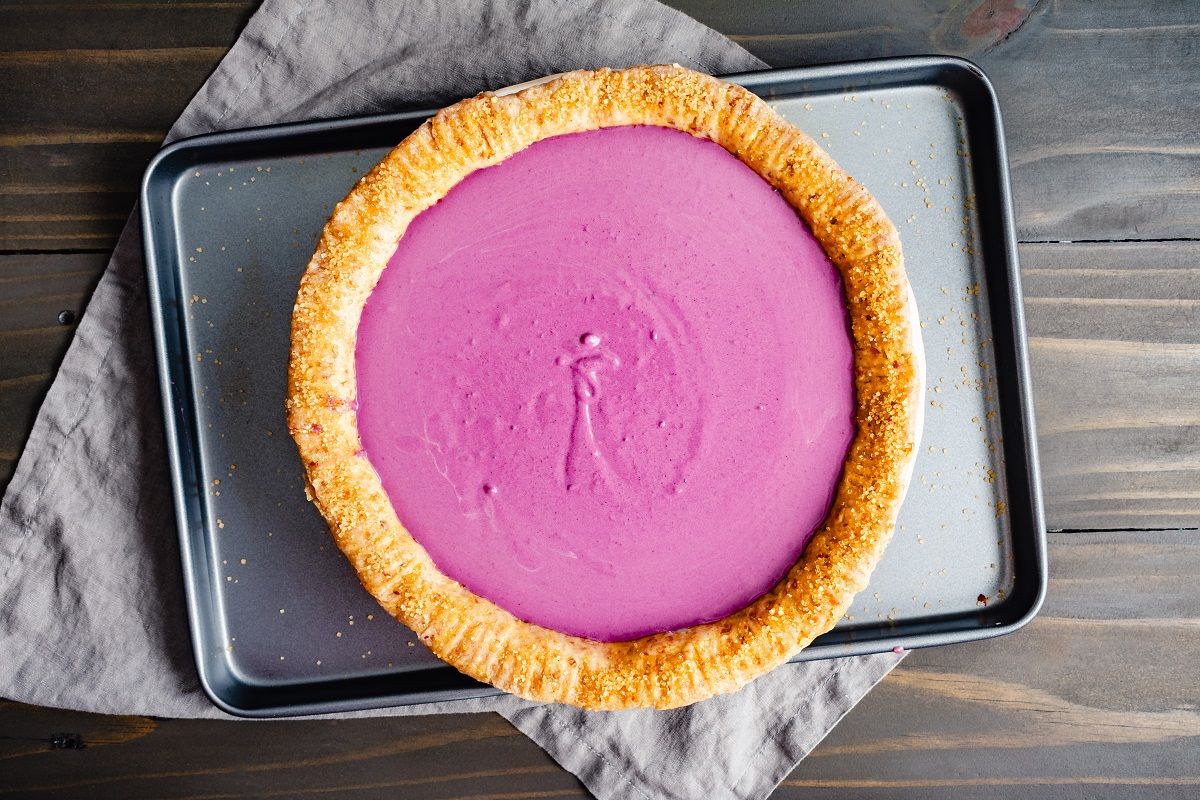 Blind Baked Pie Crust with Purple Sweet Potato Pie Filling: Unbaked purple sweet potato pie with pecan shortbread cookie crust and turbinado sugar