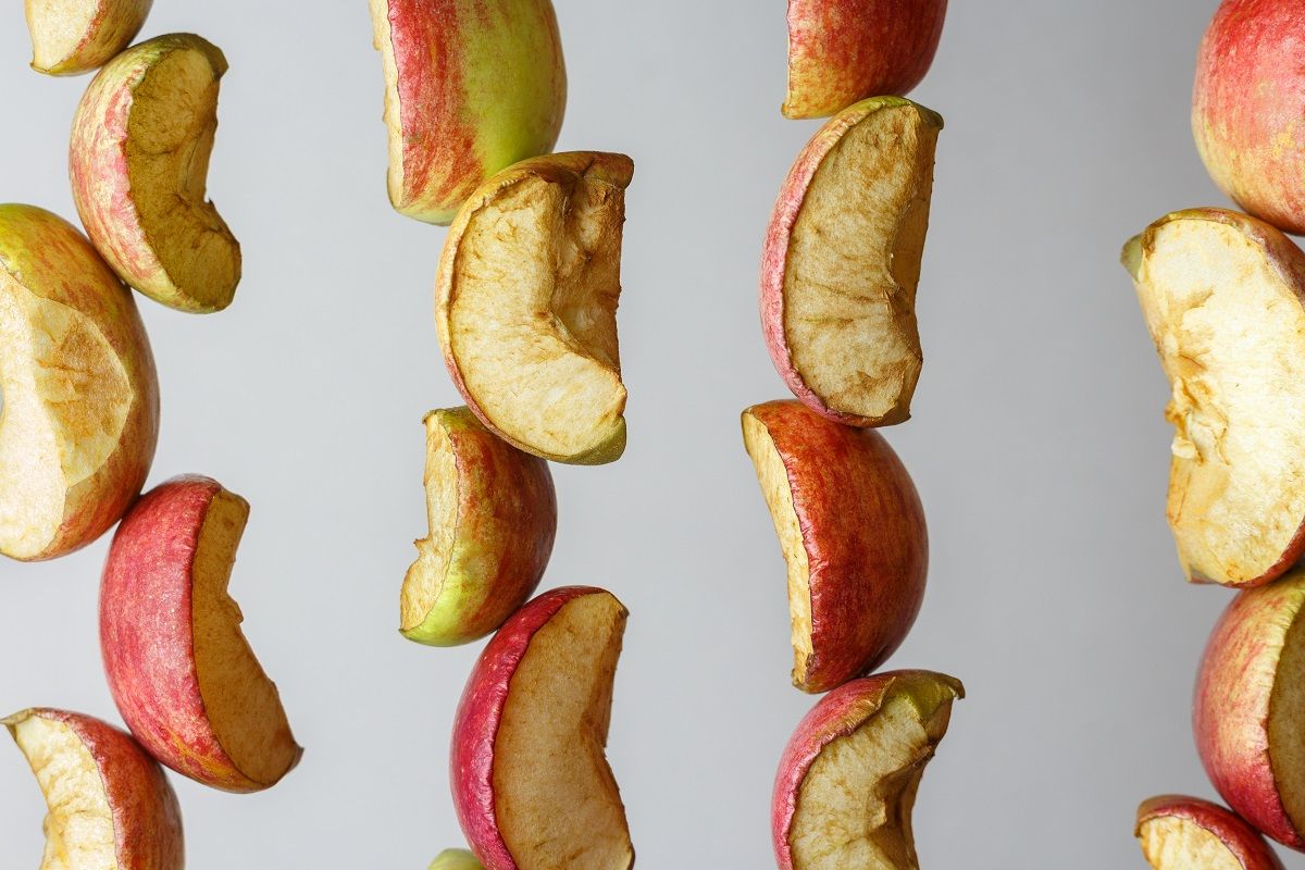 Drying multi-colored pieces of apples, close-up