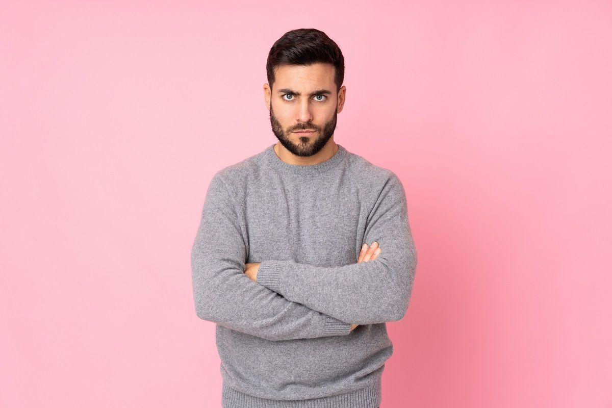 Caucasian handsome man over isolated background feeling upset