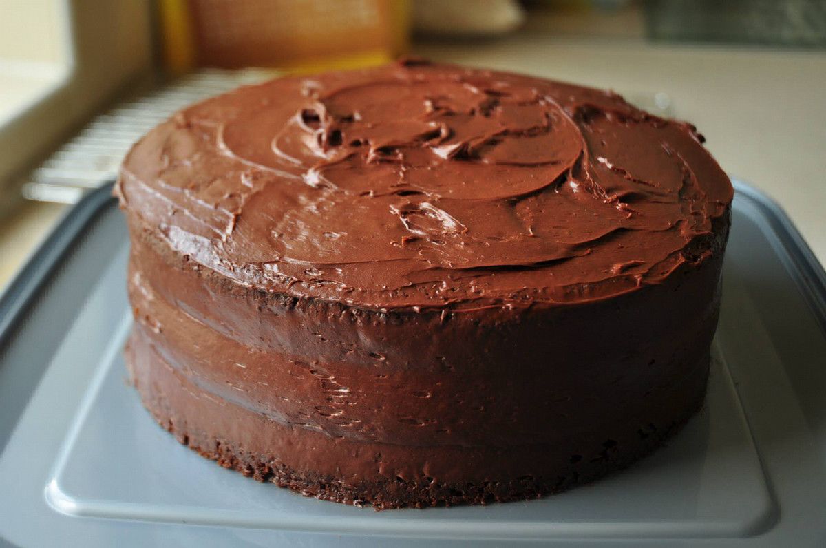 A chocolate cake on a kitchen counter