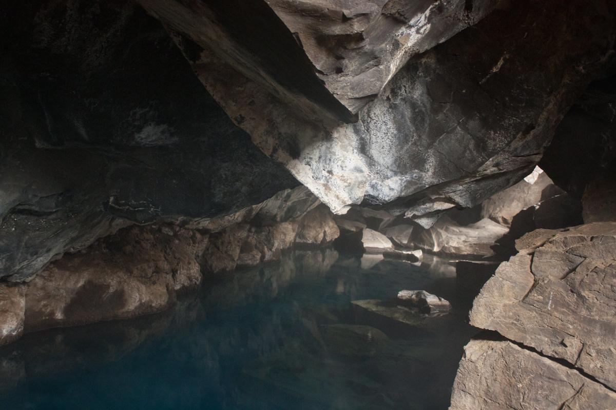 A cave with a small body of water inside