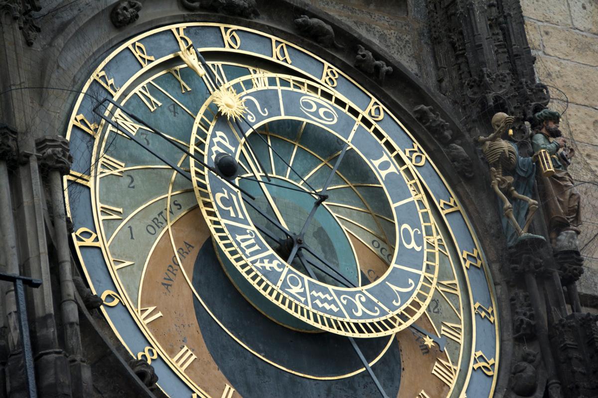 An elaborate clock face set in a stone tower