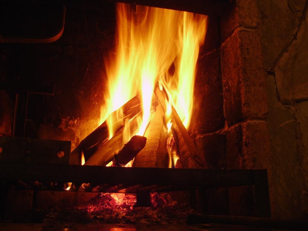 A fire going strong inside a fireplace
