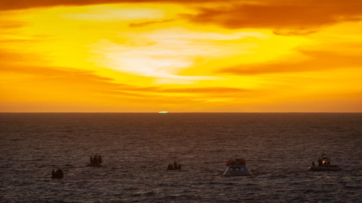 A sunset with a brief green flash as NASA recovers Orion test capsules from the water