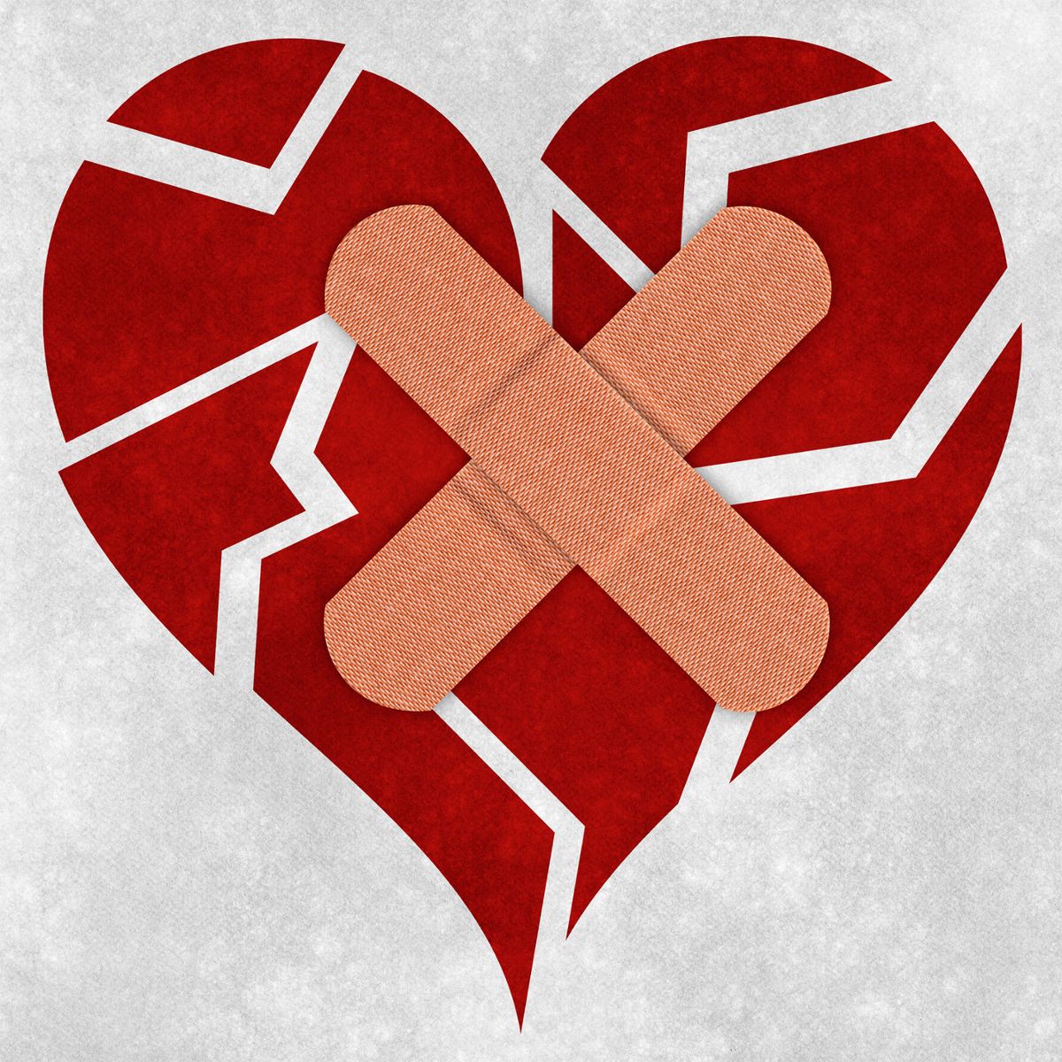 An illustrated broken heart with bandaids over it