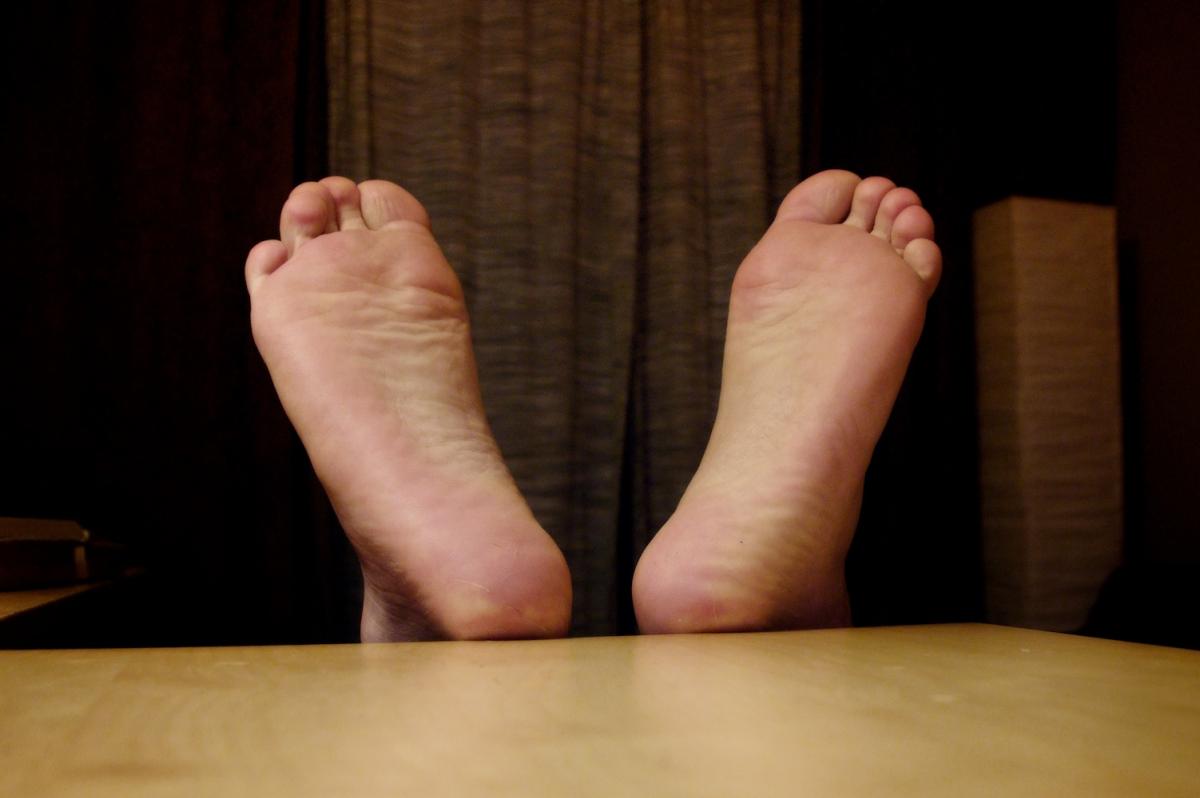 Two feet on a table.