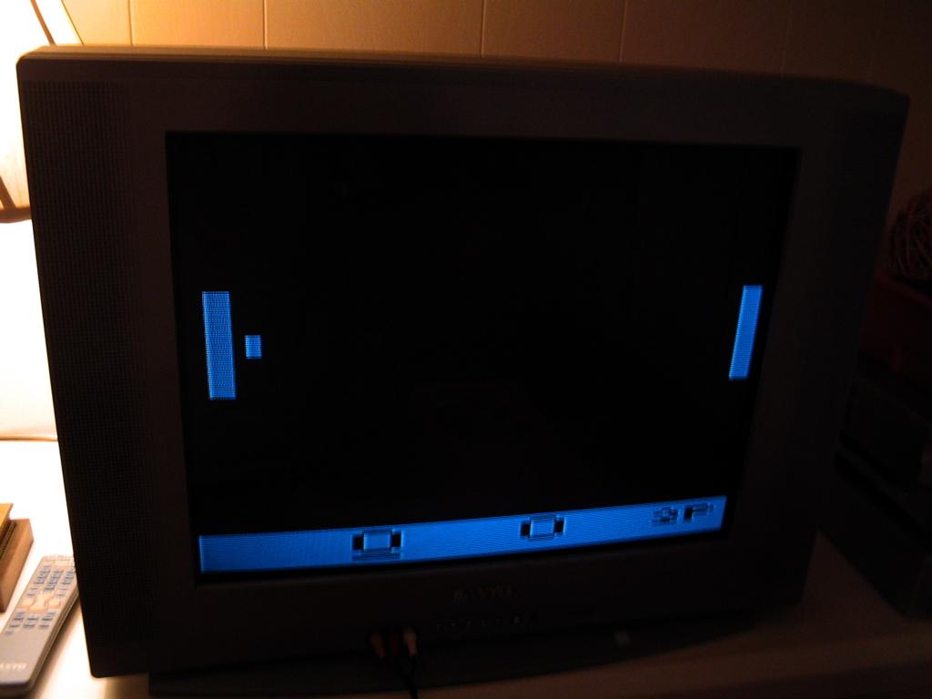 An old television with the classic game Pong just beginning