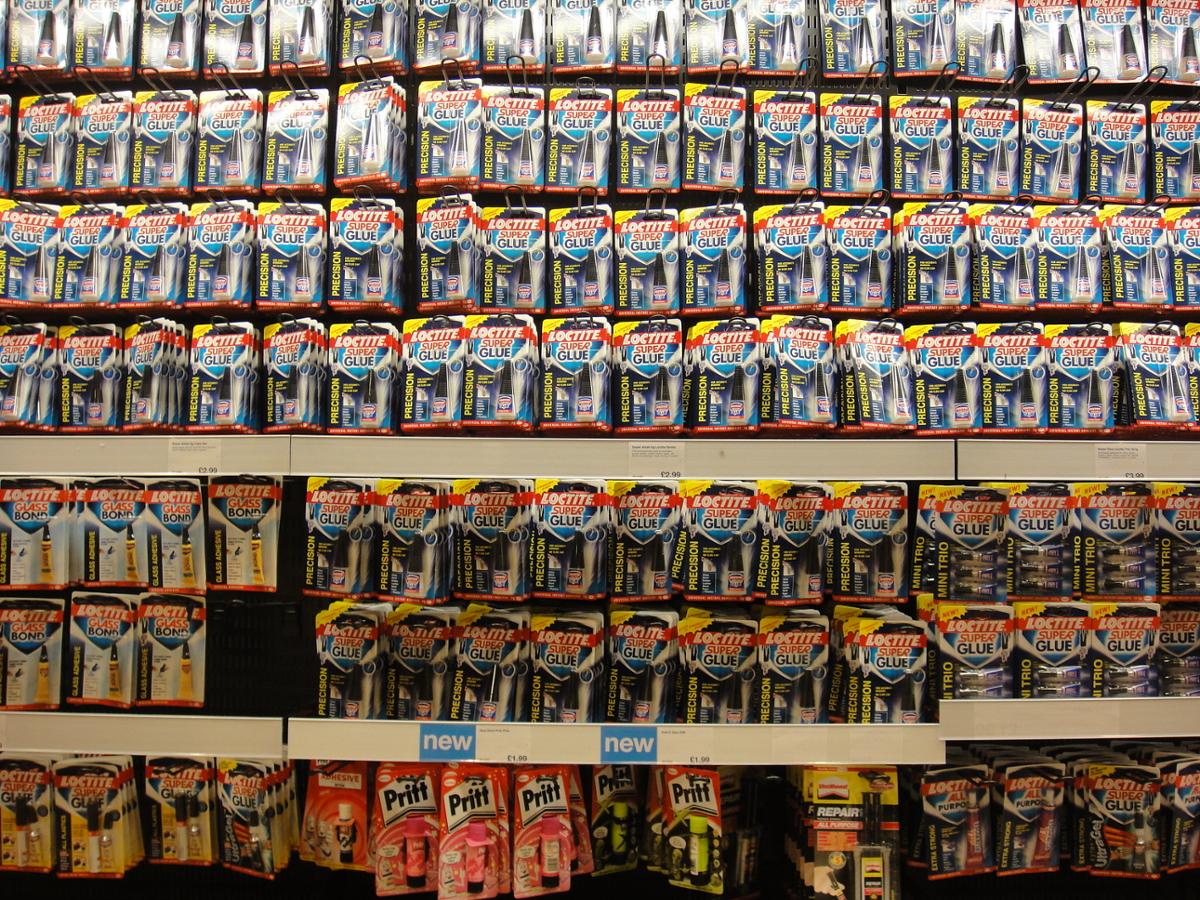 A wall in a store with lots of superglue available