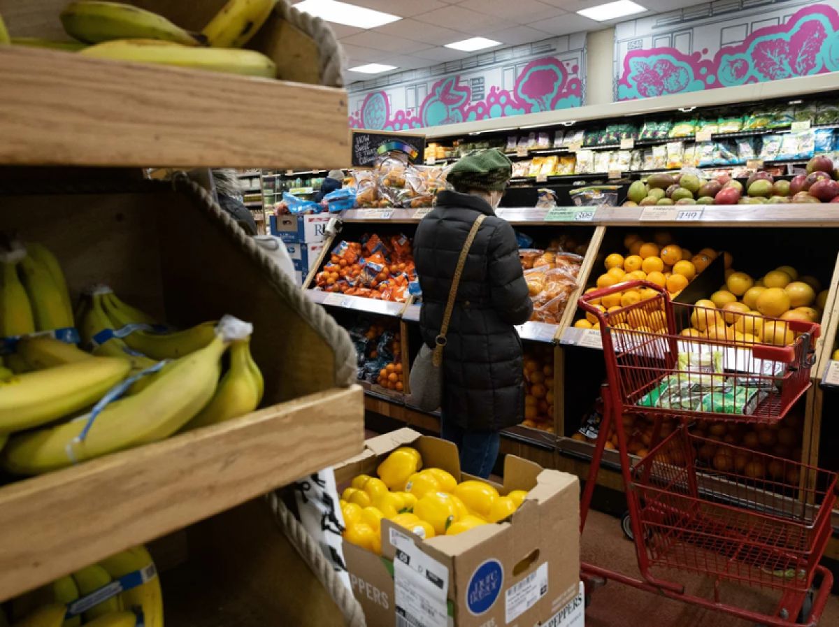 A woman selecting produce 