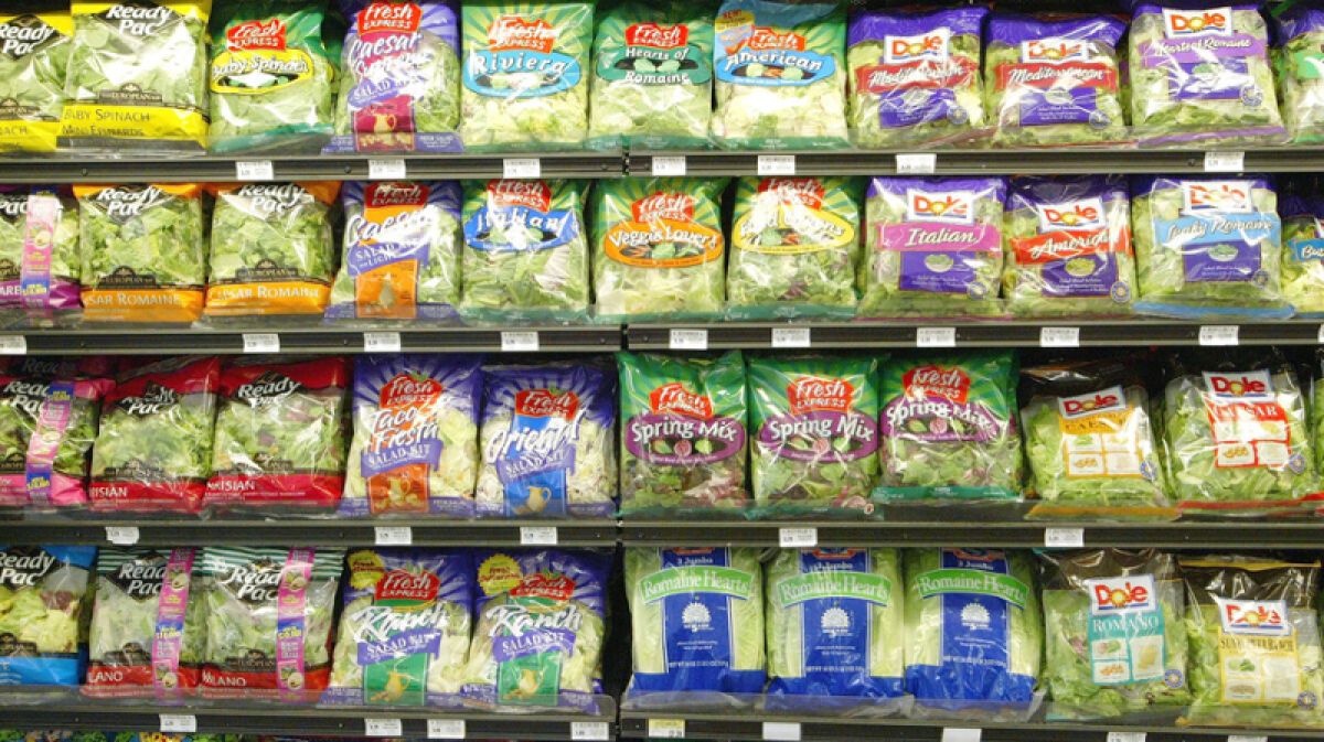 Bags of salad in the grocery store