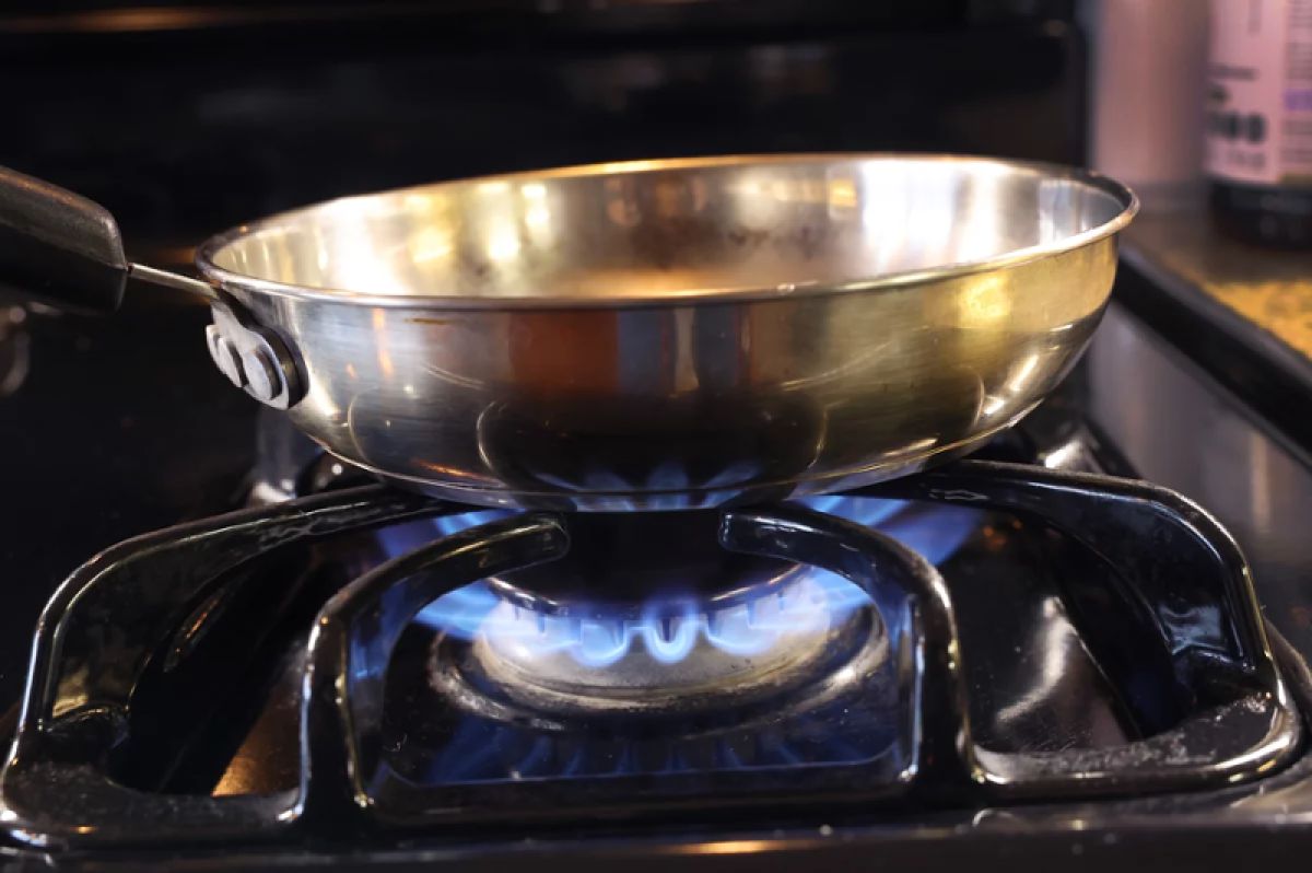 A pan being heated with a gas stove