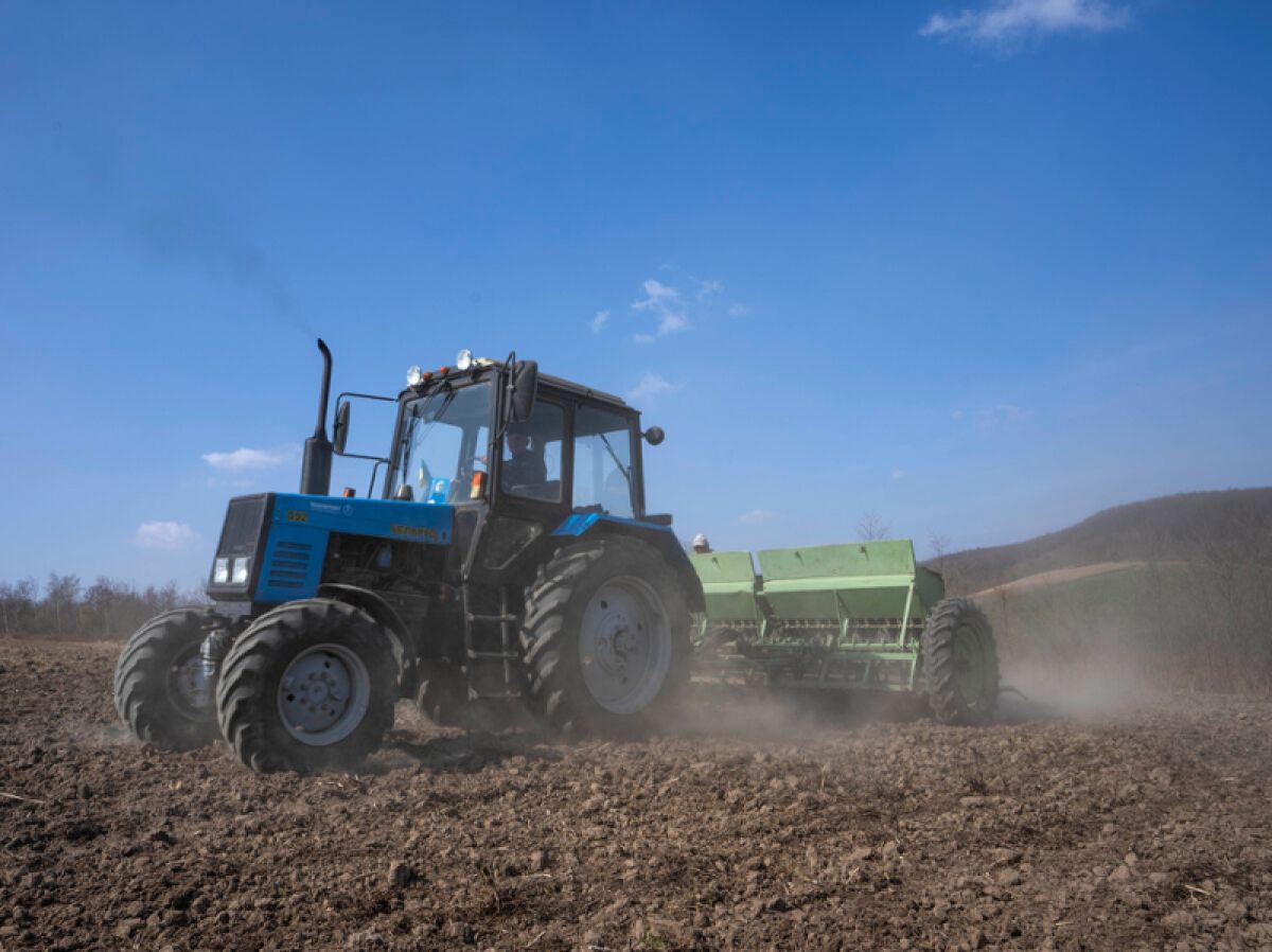 A tractor plowing a field in Ukraine