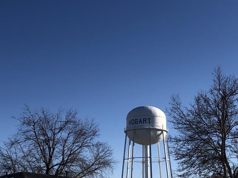 A water tower with the name Hobart against a blue sky
