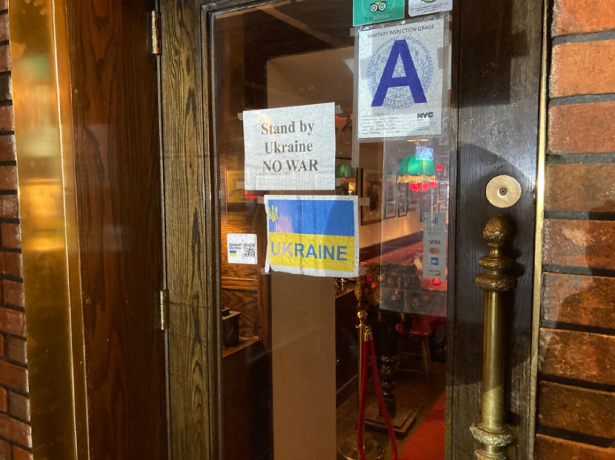Door with signs supporting Ukraine and condemning the war 